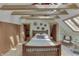 Cozy main bedroom featuring a vaulted ceiling, skylights, and hardwood floors at 37 N Main St, Indianapolis, IN 46227