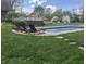 Inviting swimming pool with lounge chairs and lush landscaping, perfect for summer days at 37 N Main St, Indianapolis, IN 46227