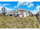 The backyard has a patio area with outdoor kitchen and pond at 4318 Ballybay Ln, Indianapolis, IN 46239