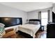 Cozy bedroom featuring a queen-sized bed and hardwood flooring at 4318 Ballybay Ln, Indianapolis, IN 46239