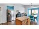 Bright dining area with stainless steel refrigerator and modern decor at 4318 Ballybay Ln, Indianapolis, IN 46239