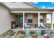 Inviting front porch with comfortable seating, decorative planters, and a cozy atmosphere at 4318 Ballybay Ln, Indianapolis, IN 46239