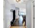 Hallway with hardwood floors, neutral walls, storage, and an open view into the living room at 4318 Ballybay Ln, Indianapolis, IN 46239