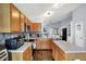 Kitchen with an open layout, wooden cabinetry, stainless steel appliances and island at 4318 Ballybay Ln, Indianapolis, IN 46239