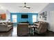 Comfortable living room with plush seating, TV, ceiling fan, and modern decor at 4318 Ballybay Ln, Indianapolis, IN 46239