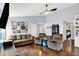 Spacious living room featuring hardwood floors, neutral walls, ceiling fan, and ample natural light at 4318 Ballybay Ln, Indianapolis, IN 46239