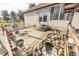 Outdoor patio with furniture and charming stone water feature, perfect for relaxing in a serene backyard setting at 4533 W 600 N, Fairland, IN 46126