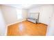 Clean bedroom with hardwood floors, a bright window and white trim at 4533 W 600 N, Fairland, IN 46126