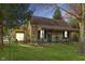 Charming home with stone and siding exterior, front porch, mature trees, and well-maintained lawn at 4533 W 600 N, Fairland, IN 46126