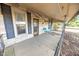 Inviting front porch with stone accents, black iron railings, and space for seating at 4533 W 600 N, Fairland, IN 46126