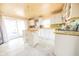 Bright kitchen with white cabinets, butcher block countertops, and a sliding glass door to the outside at 4533 W 600 N, Fairland, IN 46126