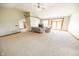 Spacious living room features high ceilings, neutral carpet, wood trim, and natural light at 4533 W 600 N, Fairland, IN 46126