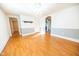 Sunlit living room showcasing hardwood floors, wainscoting, and a stylish chandelier at 4533 W 600 N, Fairland, IN 46126