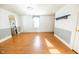 Bright living room with hardwood floors, an elegant chandelier, and an arched doorway at 4533 W 600 N, Fairland, IN 46126