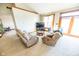 Living room with plush seating, natural light, and entertainment center with television at 4533 W 600 N, Fairland, IN 46126