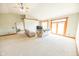 Bright living room with vaulted ceiling, carpet flooring, and large glass doors for ample natural light at 4533 W 600 N, Fairland, IN 46126