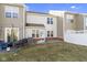 Private backyard featuring a well-maintained lawn and a covered patio area, ideal for outdoor living at 459 Dekalb Dr, Westfield, IN 46074