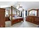 Spacious main bedroom with vaulted ceiling, fan and wooden furniture at 459 Dekalb Dr, Westfield, IN 46074
