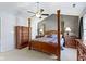 Large main bedroom features a four-poster bed, vaulted ceiling, and traditional-style furnishings at 459 Dekalb Dr, Westfield, IN 46074