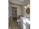 Bathroom featuring white vanity, toilet, and nearby walk-in closet at 4953 Mccray St, Indianapolis, IN 46224