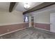 Bedroom with neutral walls, wood ceiling beams, and carpet at 4953 Mccray St, Indianapolis, IN 46224