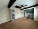 Spacious bedroom featuring a ceiling fan, carpet floors, and multiple entryways that lead to other rooms at 4953 Mccray St, Indianapolis, IN 46224