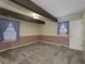 Carpeted bedroom featuring wooden beam ceiling and purple curtains at 4953 Mccray St, Indianapolis, IN 46224