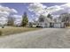 Beautiful house with a long gravel driveway and an attached garage at 4953 Mccray St, Indianapolis, IN 46224