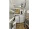 Functional laundry room with a washer, dryer, and ample shelving for storage at 4953 Mccray St, Indianapolis, IN 46224
