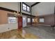 A cozy living room area with a chandelier, and a red entry door at 4953 Mccray St, Indianapolis, IN 46224