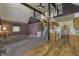 A living room with a chandelier, loft, carpet, and hardwood flooring at 4953 Mccray St, Indianapolis, IN 46224