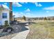 Spacious backyard featuring a decorative patio, lush greenery, and a white fence, perfect for outdoor activities at 5420 W Goeller W Rd, Columbus, IN 47201