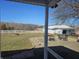 Spacious backyard with a patio, fire pit, and a large barn in a peaceful, rural setting at 5420 W Goeller W Rd, Columbus, IN 47201