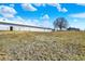 Expansive property with long, white barn and mature tree at 5420 W Goeller W Rd, Columbus, IN 47201