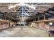 Barn interior features a spacious layout with wooden stalls and open ceiling at 5420 W Goeller W Rd, Columbus, IN 47201