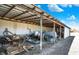 Open-sided barn structure with visible farm equipment, and blue sky background at 5420 W Goeller W Rd, Columbus, IN 47201