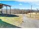 Scenic property featuring a large barn, open fields, and a gated entrance, perfect for equestrian or agricultural pursuits at 5420 W Goeller W Rd, Columbus, IN 47201