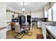Bright dining area with a glass table is centrally located to kitchen appliances at 5420 W Goeller W Rd, Columbus, IN 47201