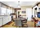 Open dining area with glass table with a view to kitchen appliances at 5420 W Goeller W Rd, Columbus, IN 47201