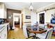 Bright and airy dining area with a glass table adjacent to the kitchen at 5420 W Goeller W Rd, Columbus, IN 47201