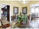 Bright dining room with a glass table and views into kitchen and living areas at 5420 W Goeller W Rd, Columbus, IN 47201