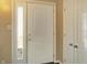 Bright entryway with a large front door and sidelight window at 5420 W Goeller W Rd, Columbus, IN 47201