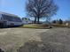 A house and barn featuring a large parking area and spacious backyard at 5420 W Goeller W Rd, Columbus, IN 47201