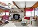 Inviting living room with stone fireplace, wood accents, and warm lighting at 5420 W Goeller W Rd, Columbus, IN 47201