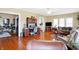 Spacious living room featuring gleaming hardwood floors, comfortable seating, and abundant natural light throughout the home at 5420 W Goeller W Rd, Columbus, IN 47201