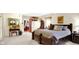 Spacious main bedroom with a luxurious bed, ample natural light, and stylish decor, creating a serene and inviting retreat at 5420 W Goeller W Rd, Columbus, IN 47201
