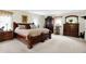 Spacious main bedroom features a large bed with decorative pillows, dresser and ample natural light at 5420 W Goeller W Rd, Columbus, IN 47201