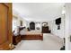 A bright and airy main bedroom featuring a large bed, dresser, and built-in storage, creating a serene retreat at 5420 W Goeller W Rd, Columbus, IN 47201