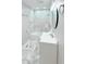 Modern bathroom with marble-style tile shower, new vanity, lighting, and a contemporary mirror at 5546 Marilyn Rd, Indianapolis, IN 46226