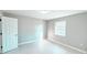 Clean, bright bedroom with light wood flooring, a neutral color scheme, and plenty of natural light at 5546 Marilyn Rd, Indianapolis, IN 46226